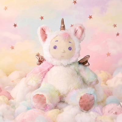 Cozy Day Dinkum - Sunbeam plush unicorn doll with pastel rainbow fur wings and a golden horn sitting among soft clouds by Cozy Day Dinkums