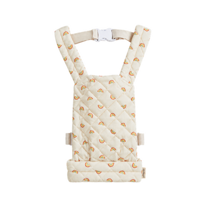 A quilted baby carrier seat pad with a repeating rainbow pattern on a cream background, shown against a plain white background.