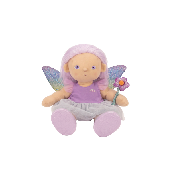 Plush fairy doll with pink hair, wings, and a flower on a white background