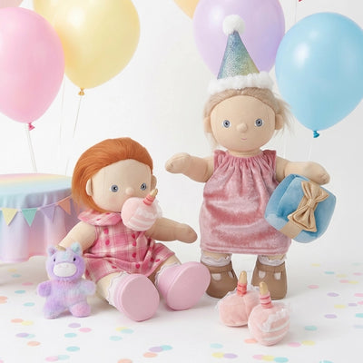 Happy Birthday Set by Dinkum Dolls with two soft dolls wearing party outfits beside a cake present plush unicorn balloons and birthday decorations