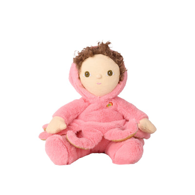 A plush doll with brown curly hair, a beige face, and a pink fuzzy hooded outfit, seated against a plain white background.