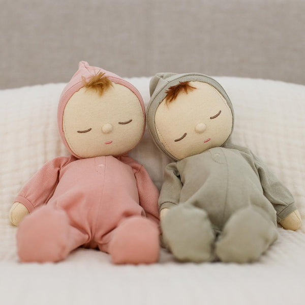 Dozy Dinkums - Moppet soft baby dolls in pink and sage green cuddle together on a cosy bed for imaginative play and gentle companionship