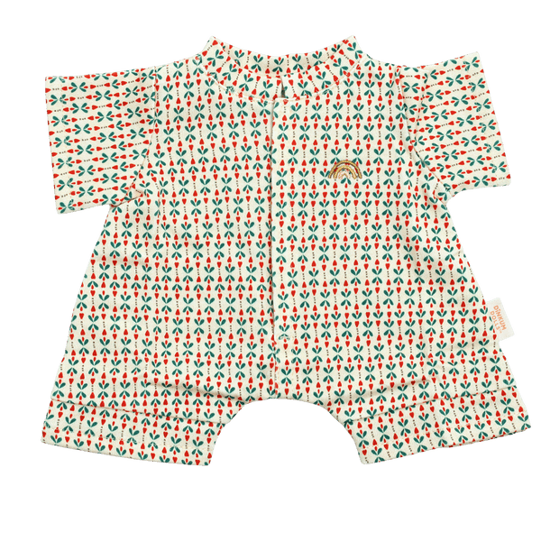 Cream short-sleeved doll romper with a small red and green sprig print, a front placket, short legs, and a small gold embroidered rainbow on the chest.