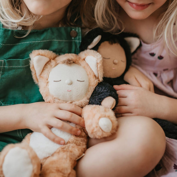 Little girl play with ginger tabby cat, soft plush toy doll for kids