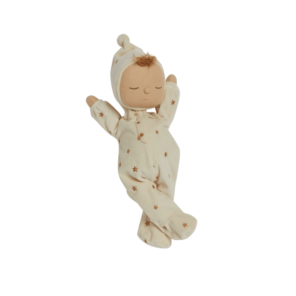 Lullaby Dozy Dinkum - Lyra soft doll wearing a cream star patterned sleepsuit and bonnet with pompom detail by Dozy Dinkums