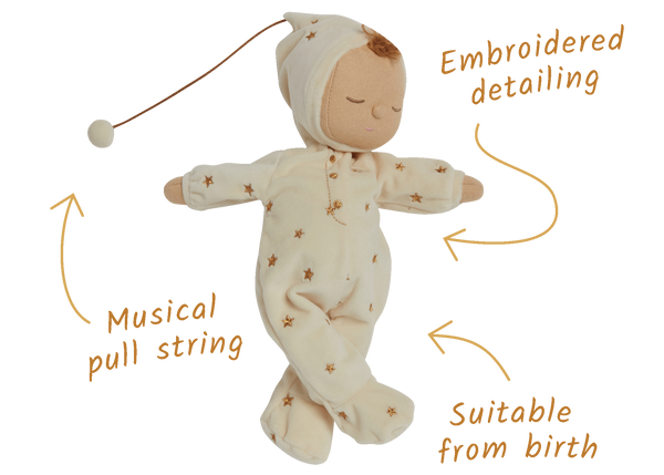 Lullaby Dozy Dinkum - Lyra by Dozy Dinkums is a soft baby doll in a star print sleeper with embroidered sleeping eyes and a removable pompom bonnet.