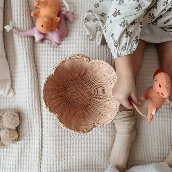 Scalloped edge handwoven rattan basket set. Pink nesting baskets perfect for storing dolls, toys, baby essentials and everything in between in your nursery or kids bedroom.