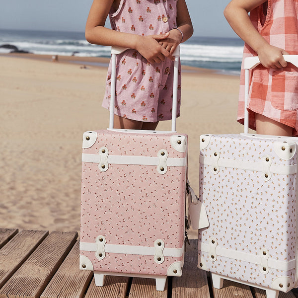 The ultimate kids travel suitcase. Pink daisies print suitcase for kids holidays, with straps to carry their favourite doll / toy.