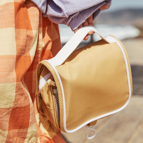 The ultimate travel toiletry bag for kids in yellow. Ideal for sleepovers, school camps, and daycare, it keeps essentials tidy and ready for fun.