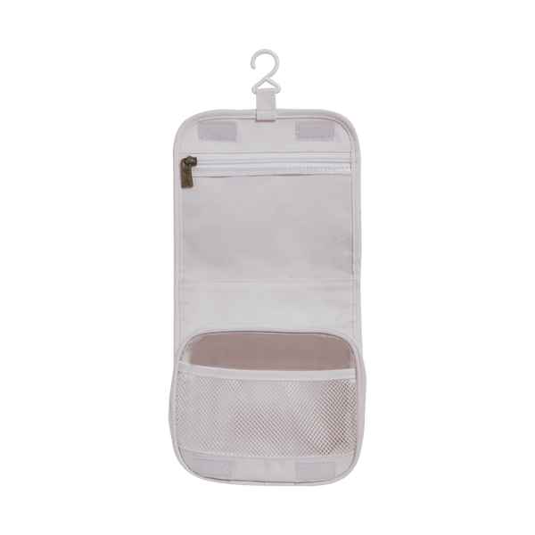 Compact, durable kids flower printed toiletry bag by Olli Ella. Perfect for toiletries and travel essentials. Ideal for organized packing, made from eco-friendly materials.