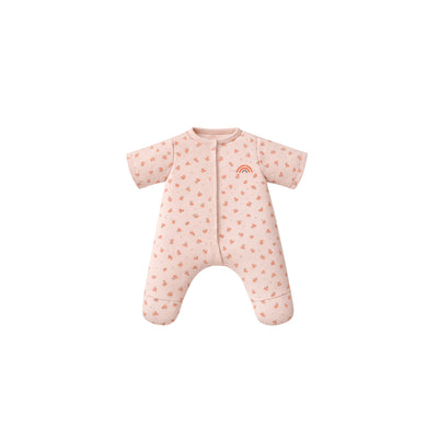 Pink baby snowsuit with rainbow design on a white background