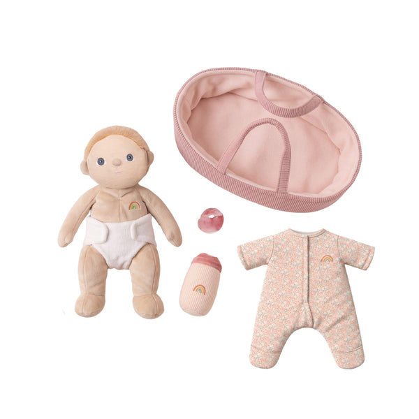 Baby doll with accessories including a pink hat, onesie, and pacifier on a white background