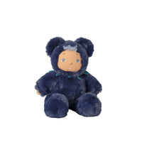 A plush teddy bear doll wearing a dark navy blue hooded outfit with a small teal bow, set against a plain white background.