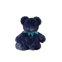 A dark navy blue plush teddy bear viewed from the back, featuring a teal bow around its neck, isolated on a solid white background.