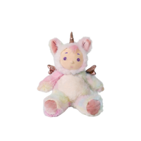 Plush toy unicorn with rainbow fur on a white background