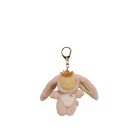 Plush keychain with a sleeping baby design on a white background