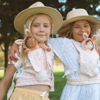 This soft, easter-themed pink doll carrier features adjustable straps and a snug fit, ideal for kids to tote their dolls comfortably. Perfect bunny-themed doll accessory, plush carrier for toddlers.