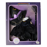 A boxed doll outfit set labeled 'Little Witch Dress-Up' by Dinkum Dolls, containing a black glittery witch hat with a purple ribbon, a black dress with a white collar and rainbow detail, and a black wand, all displayed inside a purple window box.