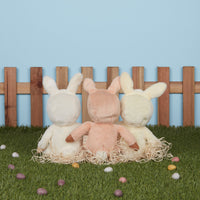 A soft, cuddly plush bunny toy with a apricot-colored coat, perfect for small hands and imaginative play. Perfectly weighted and collectable easter-themed plush toy.