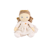 Plush doll dressed as an angel, with fluffy light-brown hair in pigtails, embroidered blue eyes, a gold velvet halo and wings, a cream velvet top with a small rainbow patch, a cream tulle skirt with gold glitter dots, and cream booties.