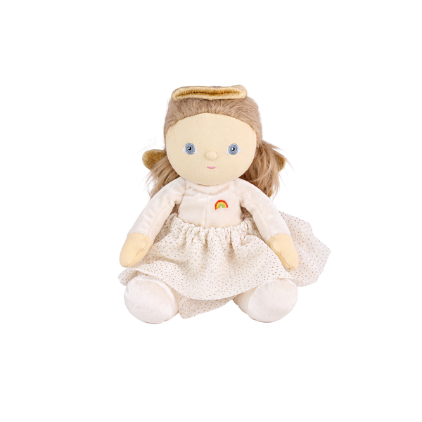 Plush doll dressed as an angel, with fluffy light-brown hair in pigtails, embroidered blue eyes, a gold velvet halo and wings, a cream velvet top with a small rainbow patch, a cream tulle skirt with gold glitter dots, and cream booties.