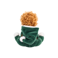 Plush doll with curly golden hair and embroidered green eyes, dressed as a Christmas elf in a dark green velvet suit and pointed hat with white fluffy trim, a brown belt, and a small rainbow patch on the chest.