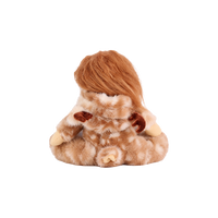Plush doll in a fluffy fawn-print deer suit with cream spots, small brown velvet antlers and soft ears, a smooth fabric face with embroidered green eyes, and a tiny rainbow patch on the chest.