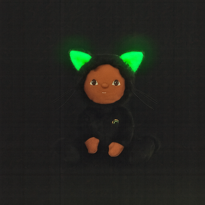 Plush toy with green glowing ears on a black background