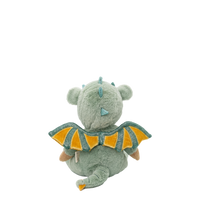 Plush toy dragon with green body and orange wings on a white background
