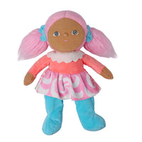 A plush doll with brown fabric skin, pink yarn hair styled in pigtails with blue bows, wearing a pink and white patterned dress and blue boot covers, isolated on a white background.
