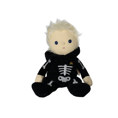 A plush doll with pale skin, spiky white hair, and blue eyes, wearing a black hooded outfit with a white skeleton print, seated against a plain white background.