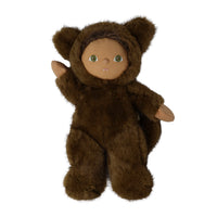 A plush doll dressed in a brown furry hooded suit with bear ears, tan face, and green eyes, posed against a plain white background.