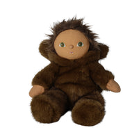 A plush doll dressed in a brown furry hooded outfit, seated against a plain white background.