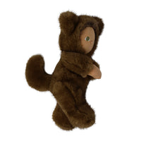 A plush toy shaped like a small brown animal in a hooded outfit, standing on its hind legs against a plain white background.