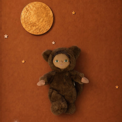 A brown plush teddy bear doll wearing a furry animal hood with small ears