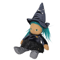 A plush witch doll with bright teal hair, wearing a dark blue velvet pointed hat with embroidered stars and a crescent moon, a dark dress with a small rainbow patch, and striped socks, shown on a plain white background.