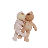 Pink, bunny printed plush doll, perfectly weighted and posable for imaginative doll play. Sodt and cuddly plush doll, an ideal companion from birth.