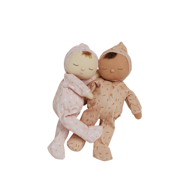 Pink, bunny printed plush doll, perfectly weighted and posable for imaginative doll play. Sodt and cuddly plush doll, an ideal companion from birth.