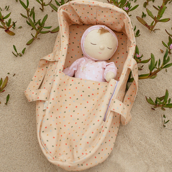 Pink, bunny printed plush doll, perfectly weighted and posable for imaginative doll play. Sodt and cuddly plush doll, an ideal companion from birth.