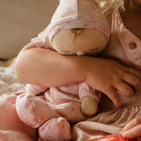 An adorable pink bunny printed plush doll, perfect for snuggling and imaginative play. Soft and cuddly doll, ideal companion from birth.