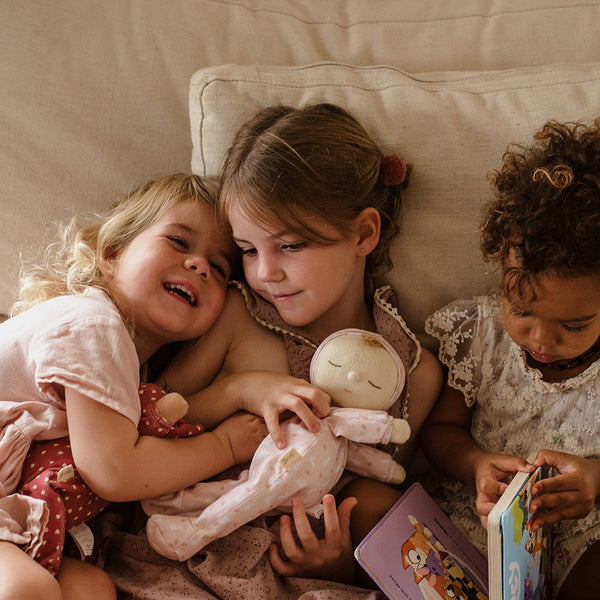 An adorable pink bunny printed plush doll, perfect for snuggling and imaginative play. Soft and cuddly doll, ideal companion from birth.