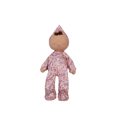Stuffed doll in a floral outfit on a white background