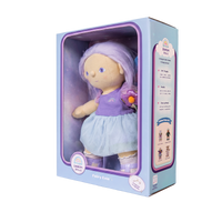 Plush doll with purple hair and outfit in a packaging box on a white background