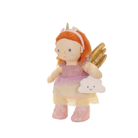 Toy fairy with red hair, gold wings, and a cloud-shaped bag on a white background