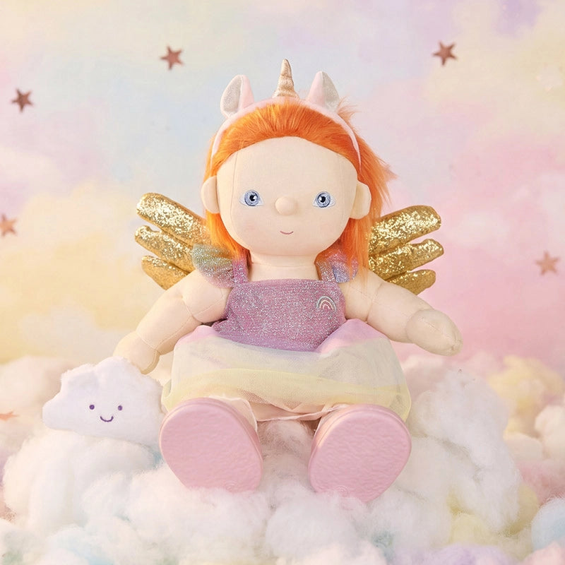 Unicorn Outfit Set with a soft doll in a sparkly pink dress and golden wings seated among clouds with a unicorn horn and rainbow details from Doll Accessories