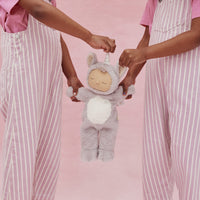 Cozy Dinkums - Unicorn - Sweetpea soft plush unicorn doll with lavender fur and white belly held by children in striped pink overalls from Dozy Dinkums