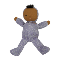 Dozy Dinkum doll with purple velvety onsie outfit. Perfectly weighted doll for calm. Plush doll with brown hair, perfect for cuddling and interactive doll play.