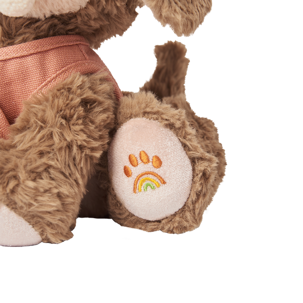Plush dog toy with super soft fabric and velvety ears. Perfect for kids play and snuggles.