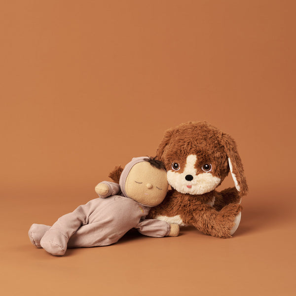 Posable soft plush dog toy with movable head and body parts.