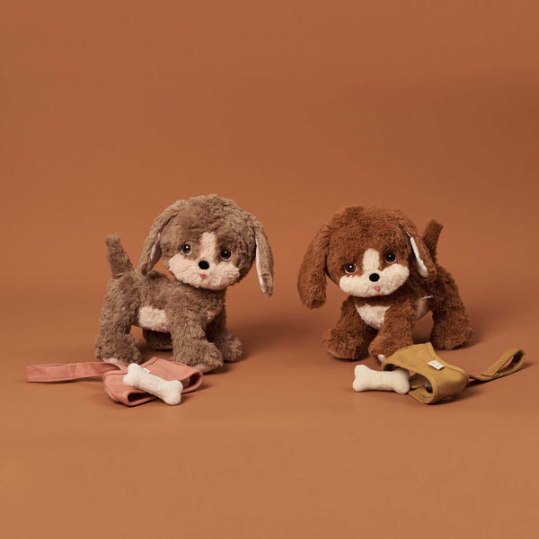Posable soft plush dog toy with movable head and body parts.